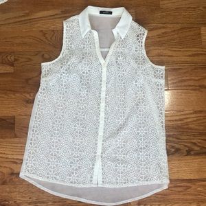 One Bundle of 2 sleeveless button down shirts.
